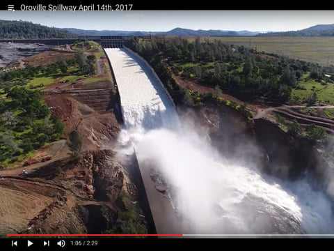 Drone footage from April 14, 2017 shows water flowing down the damaged main spillway at Lake Oroville.